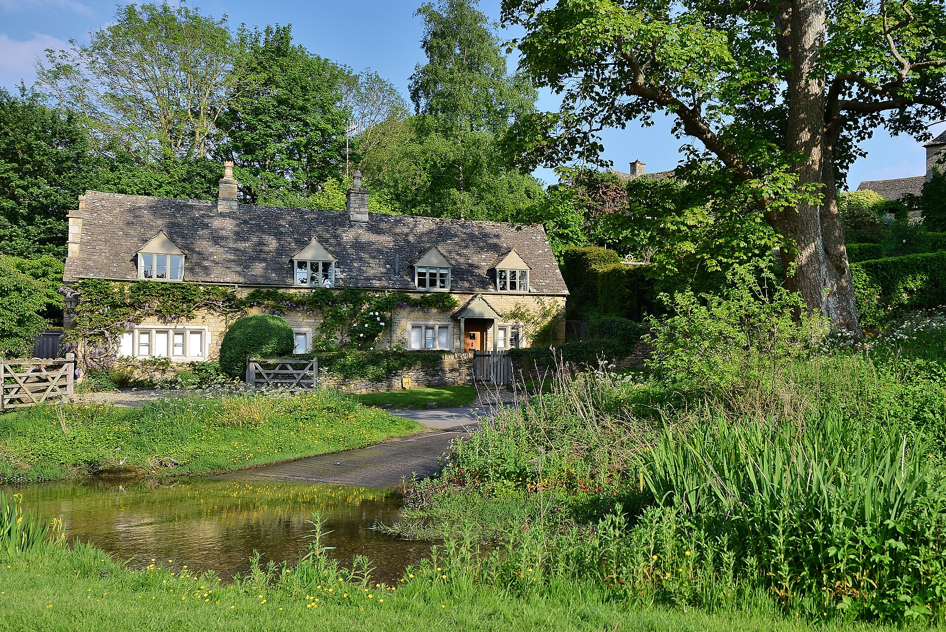 Stone buildings beside the River Eye ford in Upper Slaughter