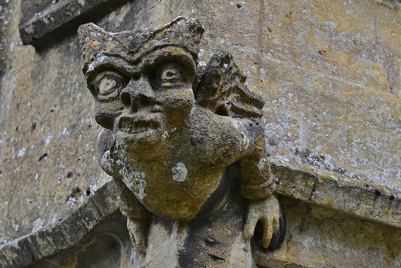 A carved stone grotesque on St Peter's Church in Winchcombe