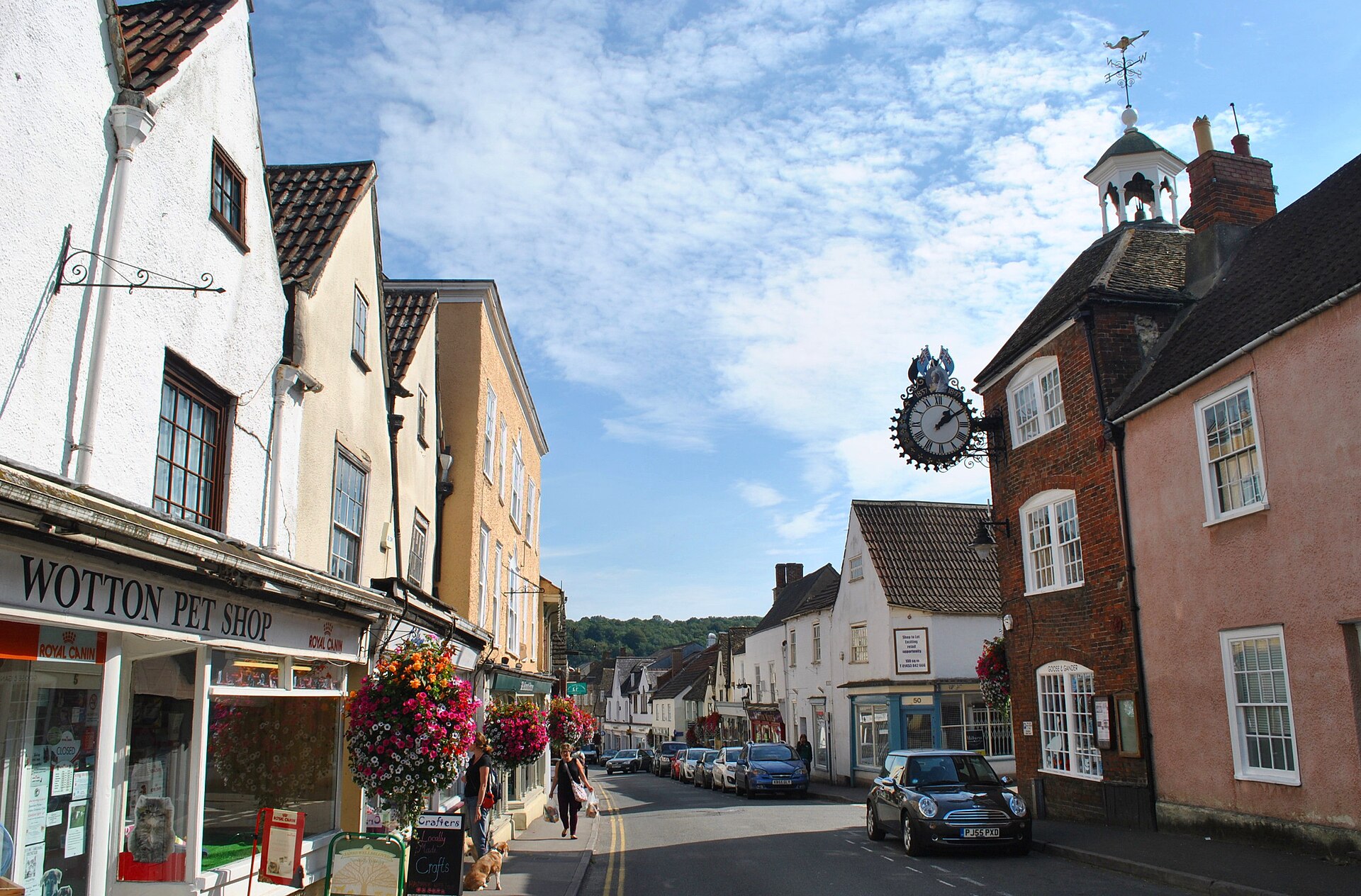 Stone buildings and shopfronts at the junction of High Street and Long Street in Wotton-under-Edge